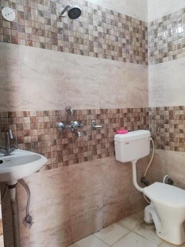 Koupelna v ubytování Anjali Home Stay