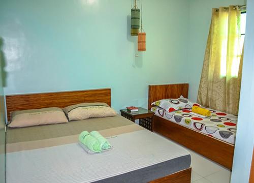 A bed or beds in a room at Terraza de Nino Resort