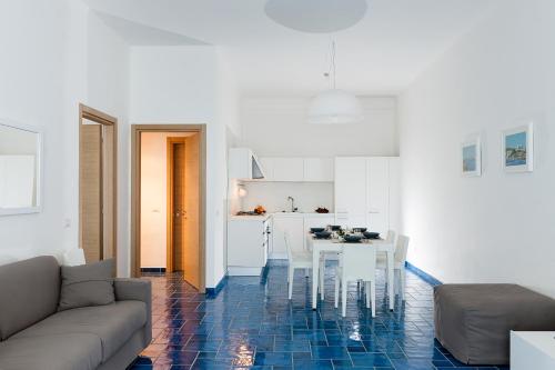 a living room with a couch and a table at NerOssidiana in Acquacalda