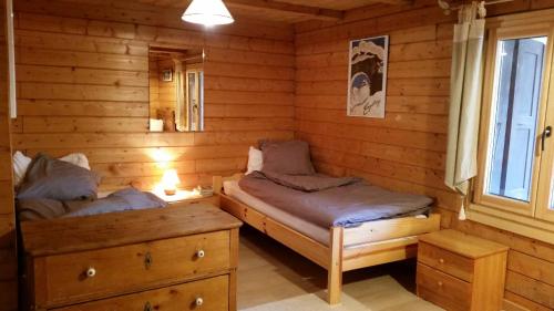Voodi või voodid majutusasutuse Chalet Beauroc toas