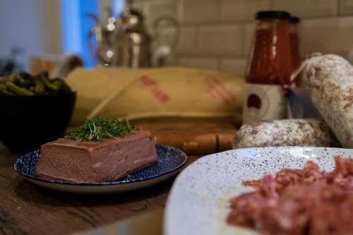 a table with a plate of food on a counter at The Vault Hotel, WorldHotels Crafted in Helsingborg