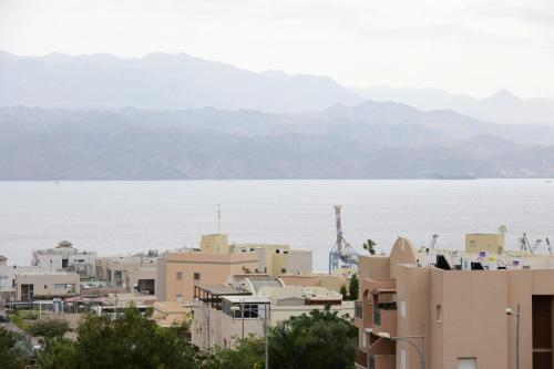 a view of a city and a body of water at Suite dream in Eilat