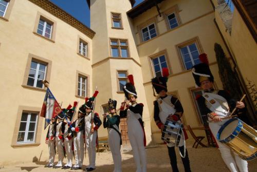 a group of soldiers in uniform standing in front of a building at Maison de la Pra in Valence