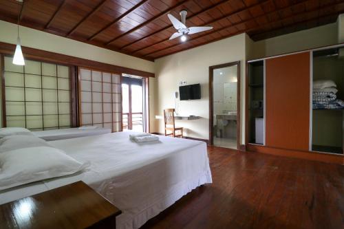 Katil atau katil-katil dalam bilik di Charme Hotel Guarujá Frente Mar