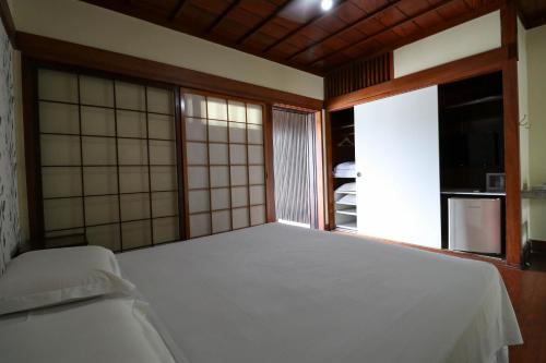 Katil atau katil-katil dalam bilik di Charme Hotel Guarujá Frente Mar