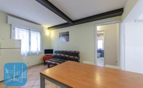 a living room with a table and a couch at Casamarin8 in Caorle