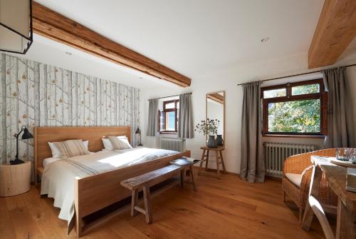 a bedroom with a large bed and a window at Hotel & Restaurant Linde in Münstertal