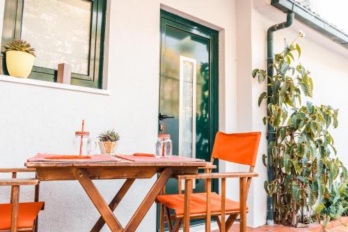 a wooden table and chairs on a patio at Casa do Carril in Mondim de Basto