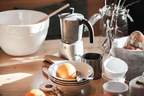 a table with a mixer and a bowl of bread at Club Nordic in Sankt Anton am Arlberg