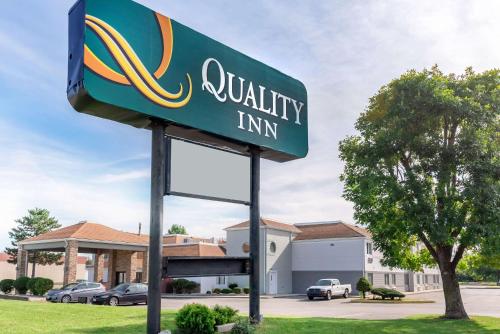 a sign for a quality inn in front of a building at Quality Inn - Fairborn in Fairborn