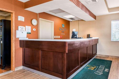 a lobby with a reception counter in a room at Quality Inn & Suites New Castle in New Castle