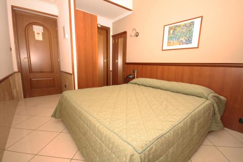 a bedroom with a bed in a room at Hotel Astrid in Milan