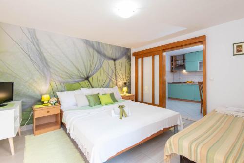 Ένα ή περισσότερα κρεβάτια σε δωμάτιο στο Apartments Lenka