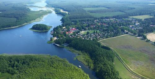 an aerial view of a town next to a river at Aparthotel Seepanorama in Mirow