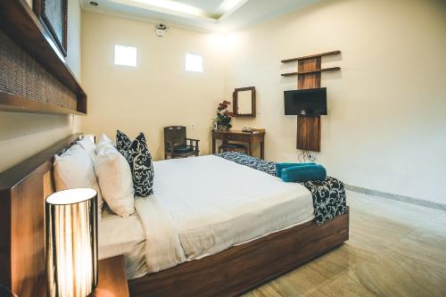 Ένα ή περισσότερα κρεβάτια σε δωμάτιο στο Ocho Bali Surf Camp