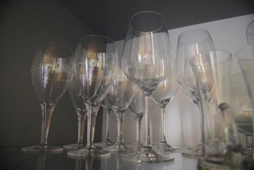 a group of wine glasses sitting on a table at Frühstückspension Pachler in Gosau