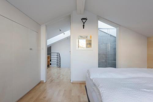 Postel nebo postele na pokoji v ubytování Ascot-Loft Zermatt
