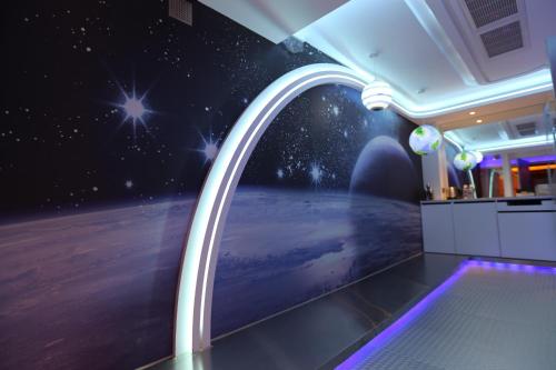 an astronomy room with an image of the universe at Yosemite Motel - Taiyuan Branch in Taichung