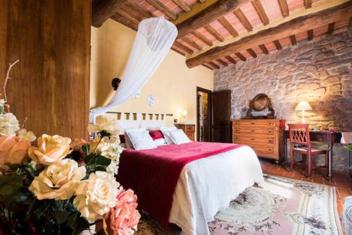 Łóżko lub łóżka w pokoju w obiekcie Agriturismo La Fagianaia