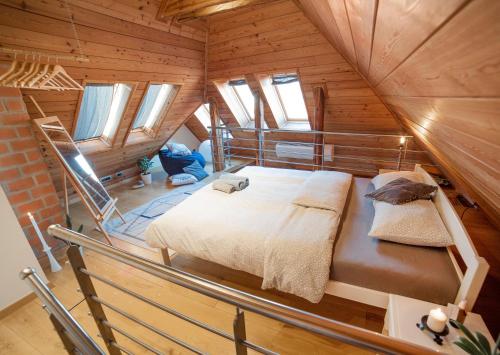 a bedroom in a wooden cabin with a bed in it at The Grič Eco Castle in Zagreb