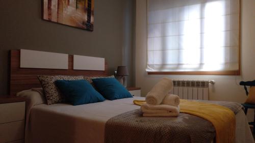 Łóżko lub łóżka w pokoju w obiekcie Muiño das Mareas