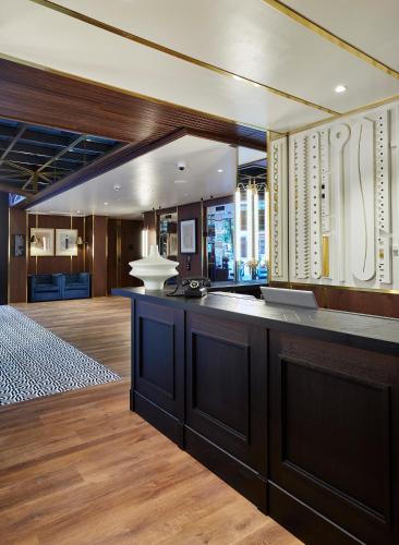 a kitchen with a large island in a room at Radisson Blu 1882 Hotel, Barcelona Sagrada Familia in Barcelona
