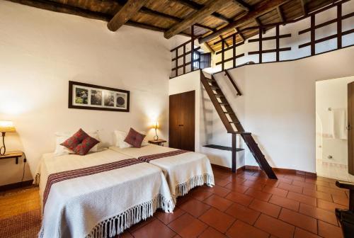 En eller flere senge i et værelse på Monte do Serrado De Baixo