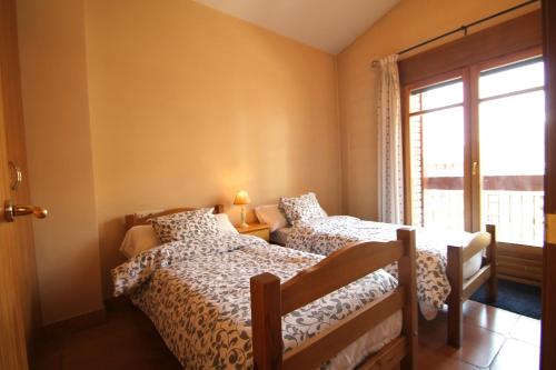 Postel nebo postele na pokoji v ubytování Borda Pascol, Atico Duplex en Tarter Zona Grandvalira