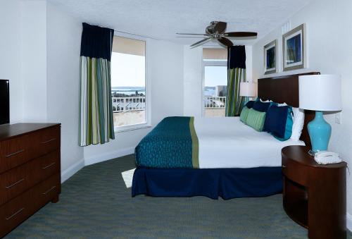 a hotel room with a bed and a window at Atlantic Terrace in Daytona Beach Shores