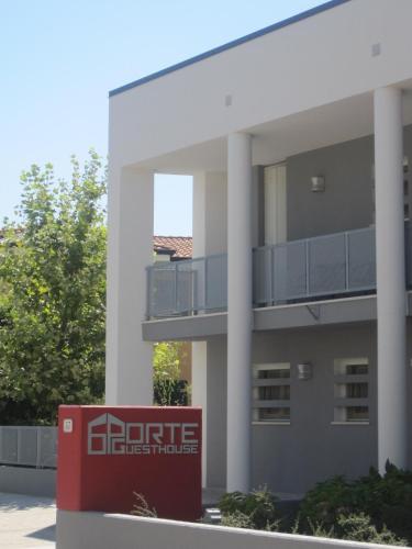 a building with a sign in front of it at 6 Porte Guesthouse in Mantova