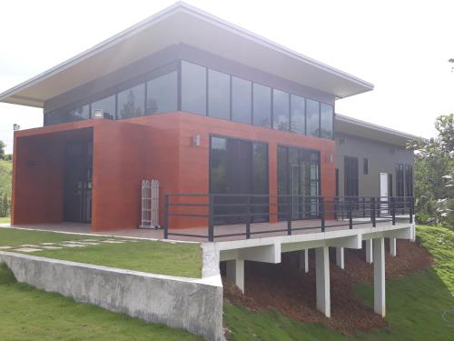 a large house with a red and black facade at C-HILL@KHAOKHO in Khao Kho