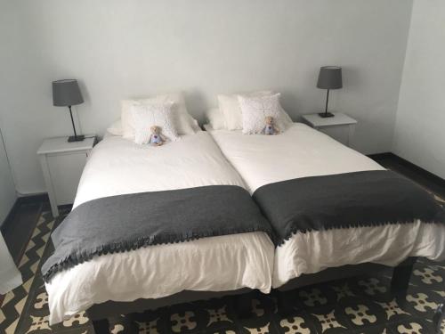 a bedroom with a large bed with two night stands at MULAGUA in Agulo