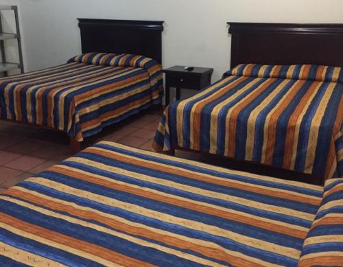 Cama o camas de una habitación en Hotel Ibiza
