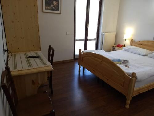 Un ou plusieurs lits dans un hébergement de l'établissement Hotel Ristorante Sassi Rossi