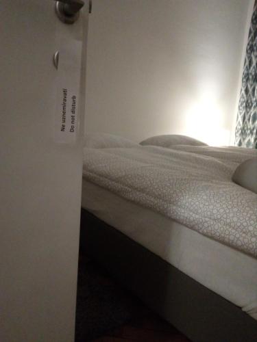 a bedroom with a bed in a room at HILLS Apartments in Vršac