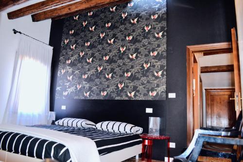 A bed or beds in a room at Casa Corte delle Ancore