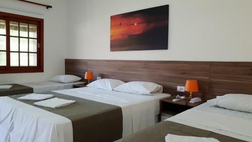 Katil atau katil-katil dalam bilik di Hotel Pousada Salvador Paradise