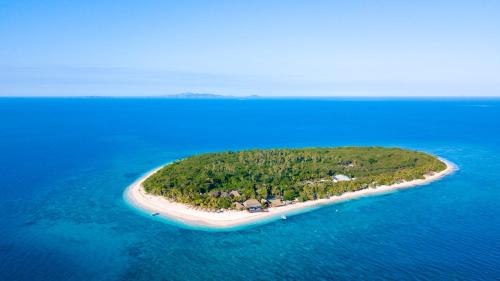 an island in the middle of the ocean at Serenity Island Resort in Mamanuca Islands