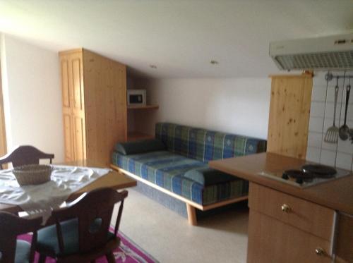 a living room with a couch and a table at Ferienhaus Bergland in Flachau