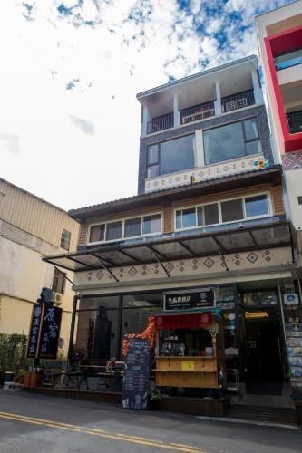 a store front of a building on a street at Yuan Su B&B in Yuchi