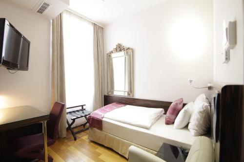 Ein Bett oder Betten in einem Zimmer der Unterkunft Best Western Plus Hotel Arcadia