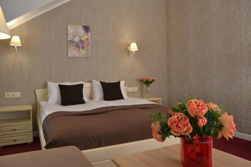 Postel nebo postele na pokoji v ubytování Hotel Ajur