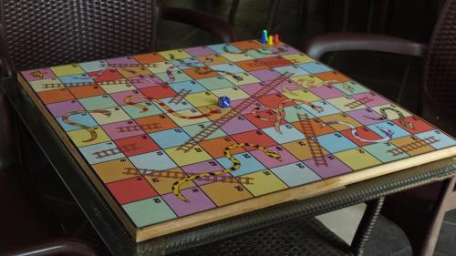 a table with a board game on it at Dew Drops Boutique Retreat in Igatpuri