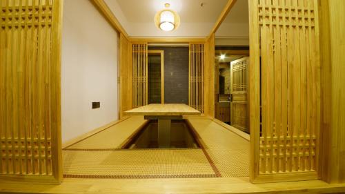 a room with a table in the middle of a room at Pipa Hotel Datong in Datong