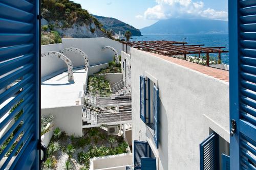 arial view of a building with a view of the ocean at NerOssidiana in Acquacalda