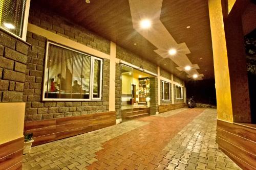 an empty hallway of a building at night at Quartz Himalayan Brothers in Dharamshala
