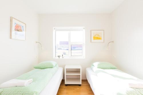 Cama o camas de una habitación en Kvöldstjarnan Gistiheimili