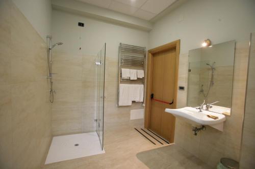a bathroom with a sink and a shower at Hotel Piazza Marconi in Cassino