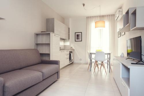 a living room with a couch and a table at Luccainn in Lucca