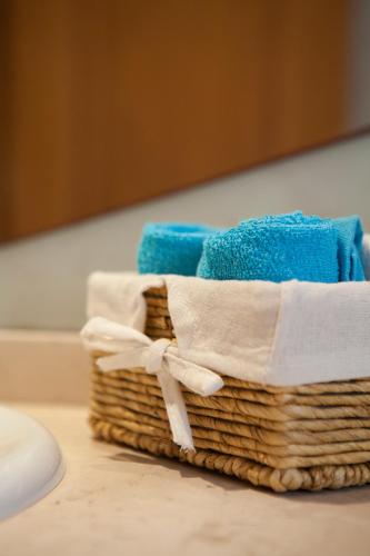 a basket of towels sitting on a table at Porto Gaia City and Beach by MP in Vila Nova de Gaia